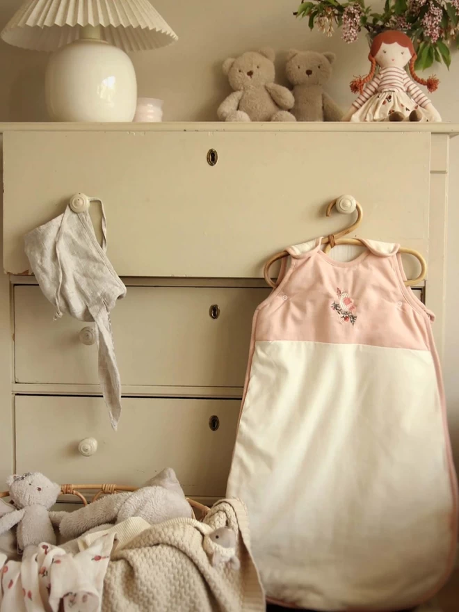 Baby Sleeping Bag in Bird design hanging on a cabinet drawer
