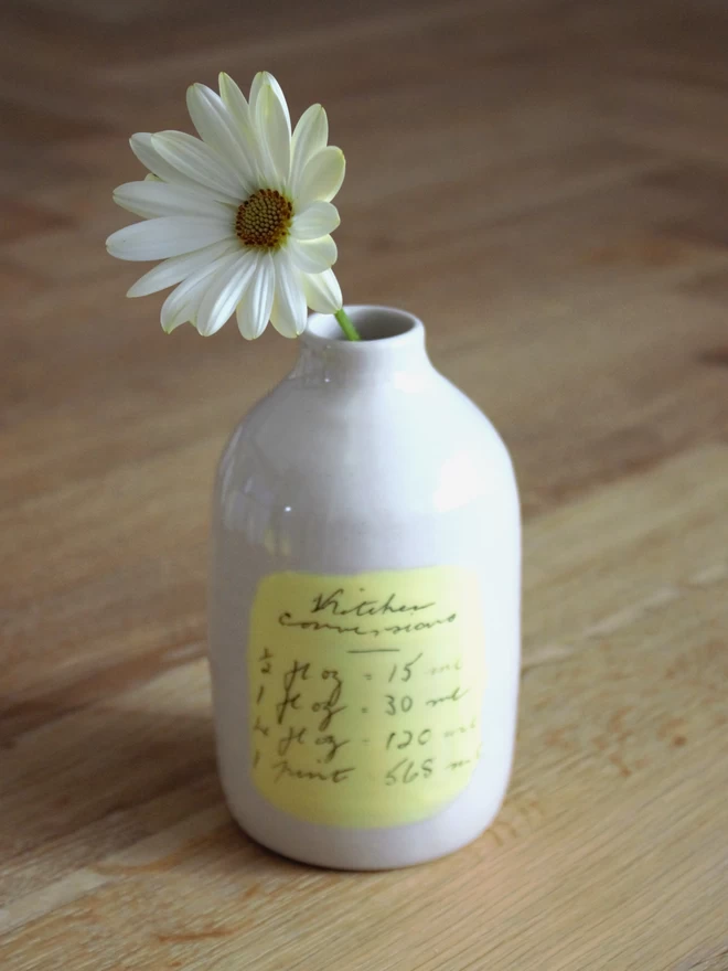 handmade ceramic bottle vase with one flower and handwritten kitchen conversions