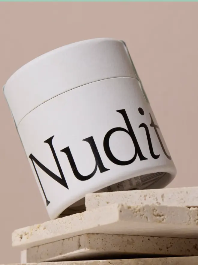 white pot of matcha with black text