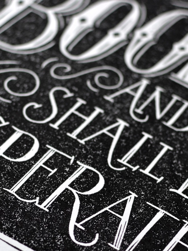 detail of lino print lettering in black and white