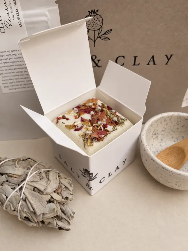 relaxing bath bomb with bergamot, rosemary and geranium essential oils. part of the calming rituals gift kit.