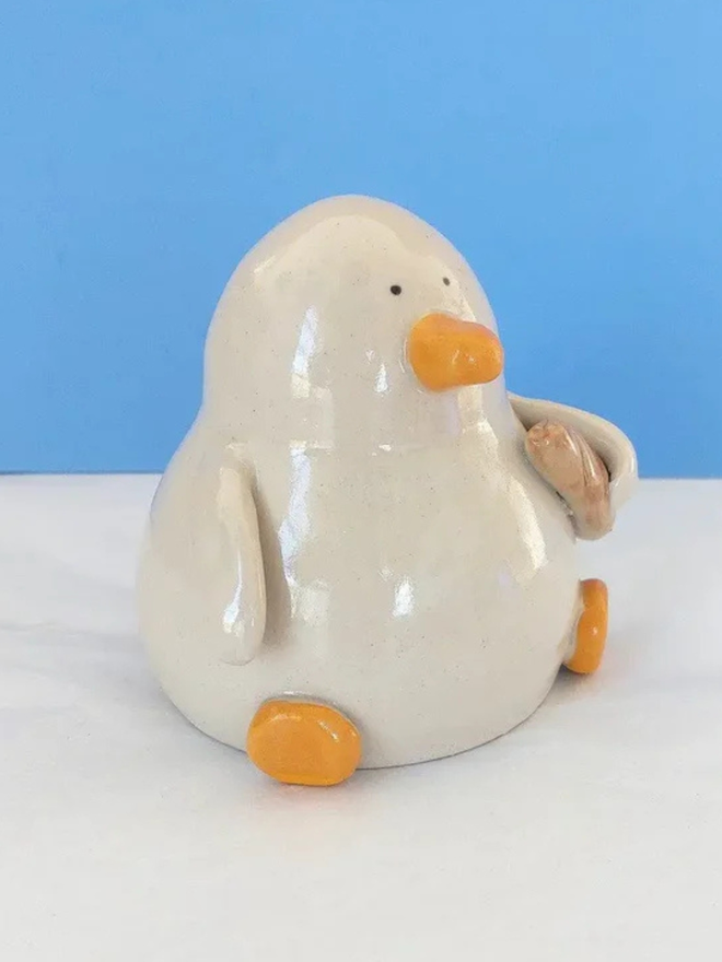 Duck with a baguette sculpture