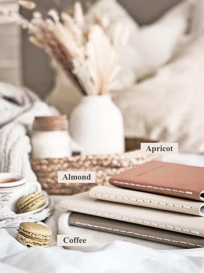 stack of journals in various neutral colours