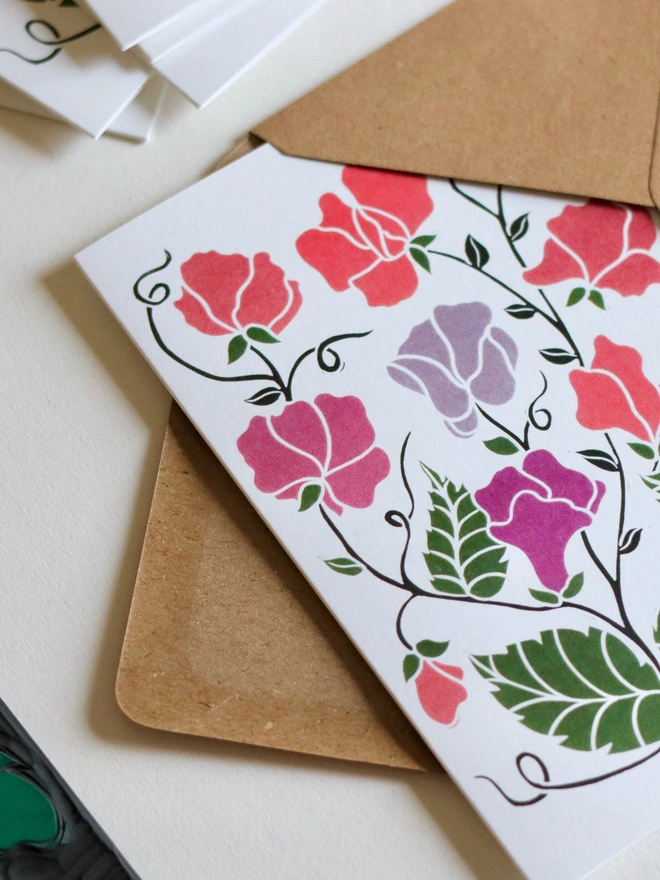 Joy Bloom Sweet Pea garden flowers notecard set with recycled kraft envelopes. Eight A6 hand-carved botanical greeting cards and matching envelopes, eco-friendly stationery perfect for thank you notes and correspondence. British flora design.