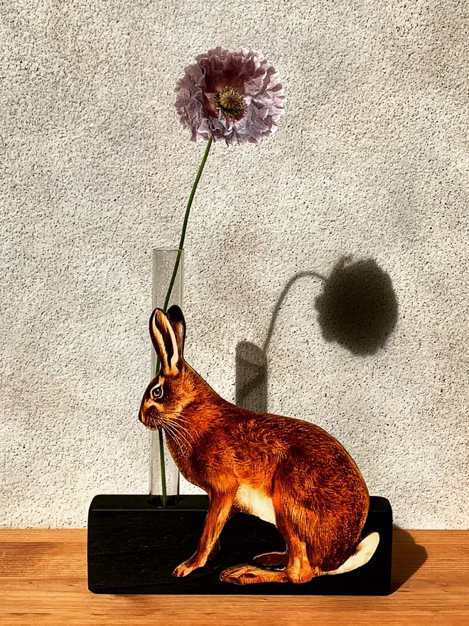 Bud vase with realistic hare detail.