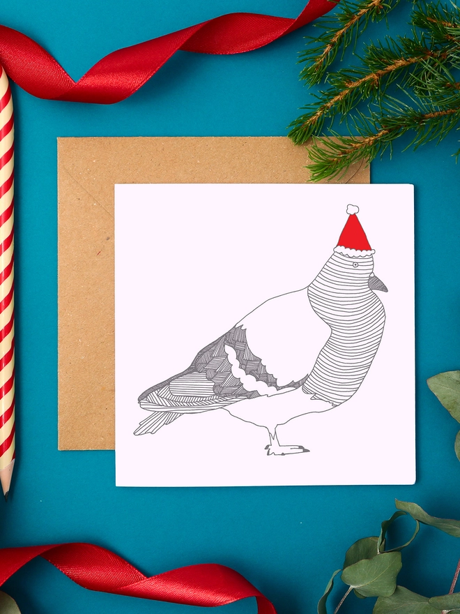 Quirky Christmas Card Featuring a Pigeon in a Santa Hat