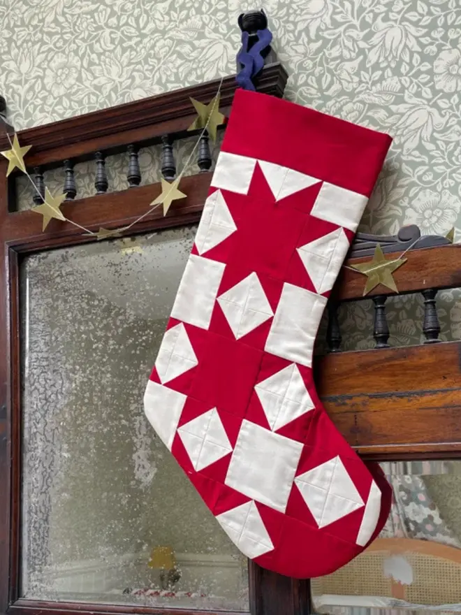 Aster Patchwork Stocking, hanging. 