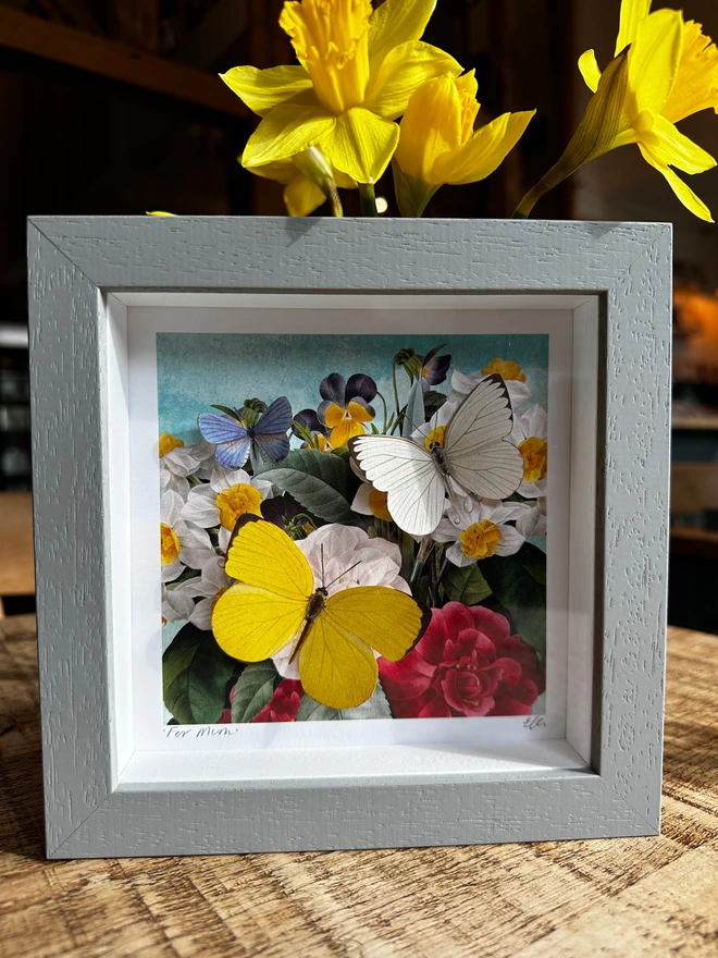 Spring floral art print with three paper hand cut butterflies in a light grey frame, personalised and signed on the front.