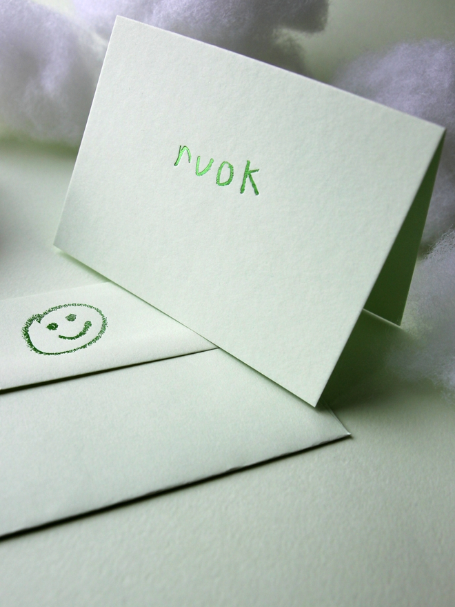 pistachio coloured card with ruok short for 'are you ok' hand foiled in kids hand writing