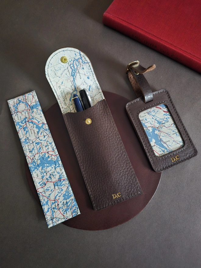 brown leather silk escape map pen case, luggage tag and bookmark