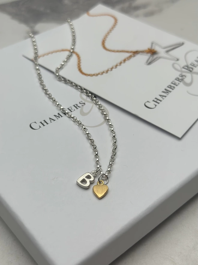 sterling silver chain with sterling silver initial charm and gold mini heart