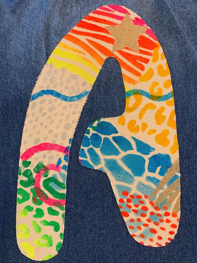 Letter A painted with patterned stencil