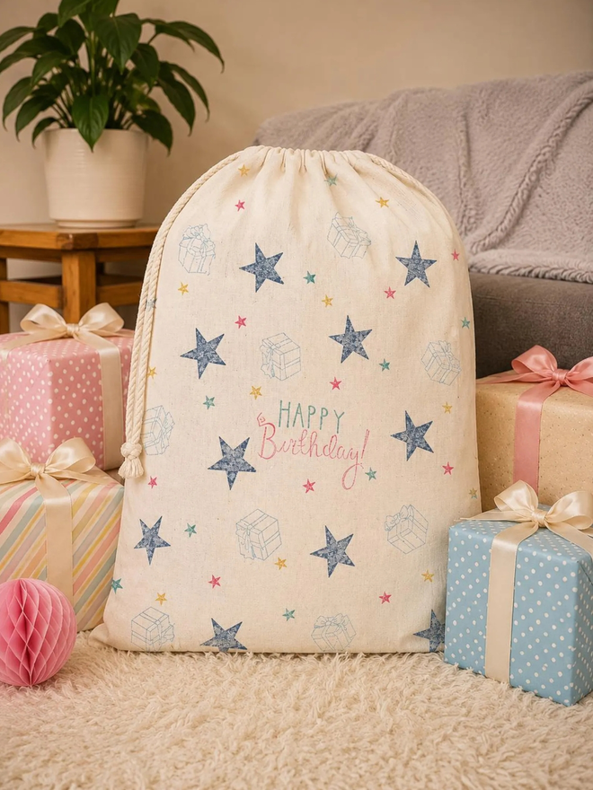 personalised drawstring birthday bag. a drawstring bag with printed stars and a birthday message.