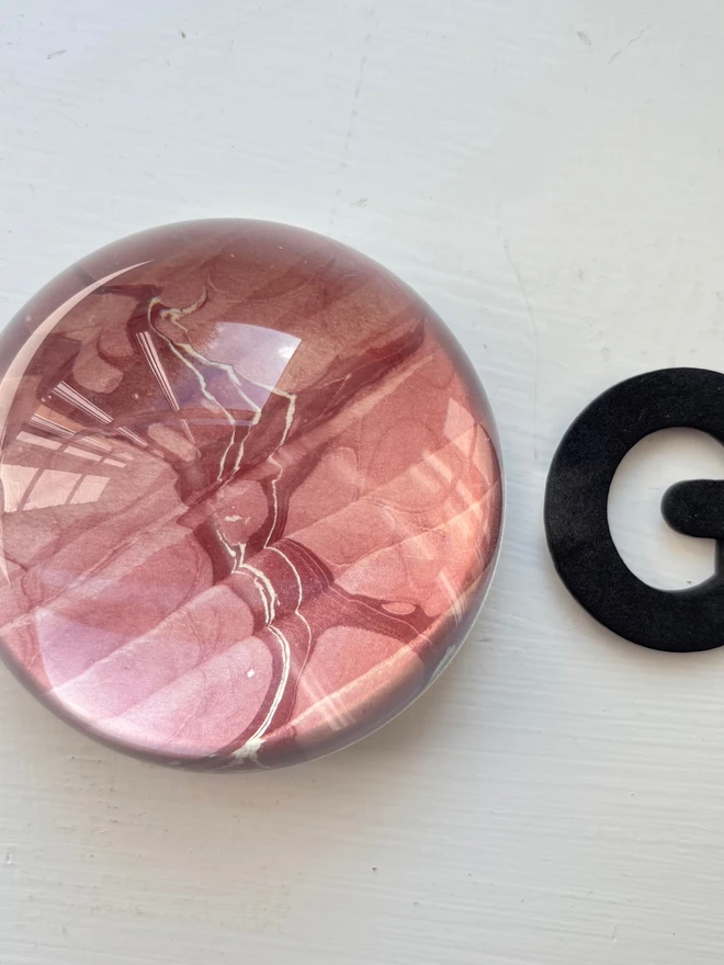 Small Paperweight. A paperweight in G