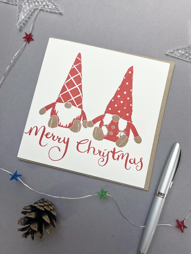 Front of the card with two Gonks in red holding hands with Merry Christmas written underneath