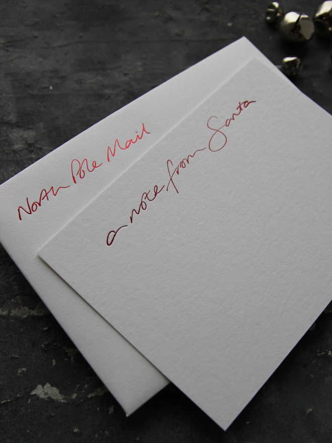 Notecards hand foiled in red says A Note From Santa with an envelope that says North Pole Mail