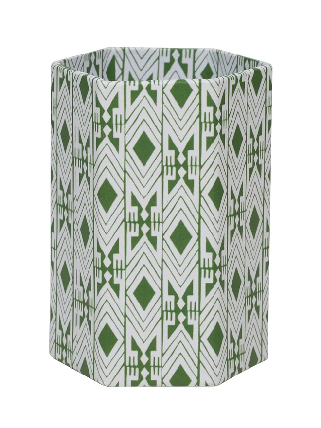 Tijan Hexagonal Brush Pot, a colourful patterned pencil pot sitting on a white surface against a plain backdrop. 