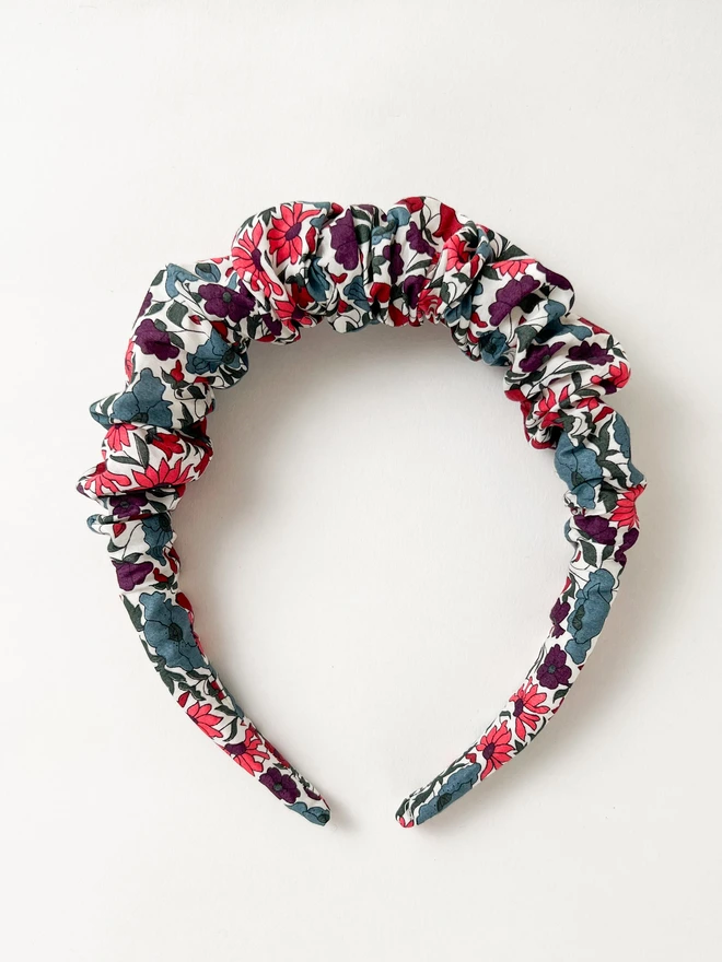 flat lay photo of ruffled hairband alice band in liberty floral fabric