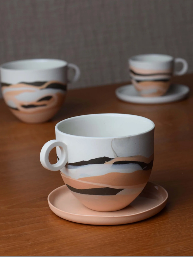 Desert Dreamlands Mug. Three mugs of the same collection with slightly different decoration.