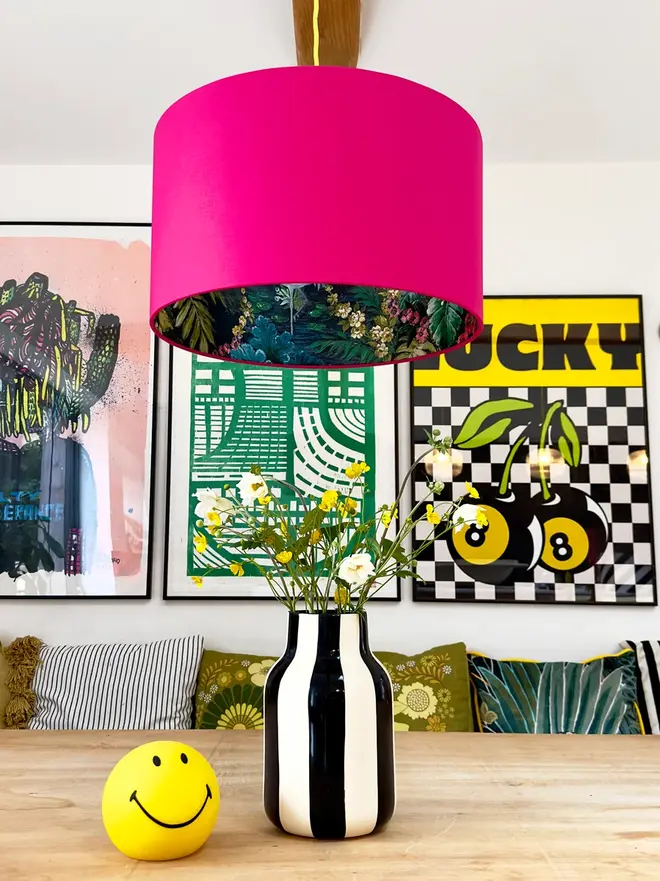 Pomegranate Pink Flight of the Cranes silhouette lampshade styled on a table lamp