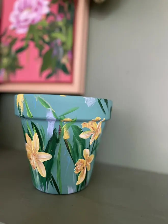  Daffodil Collection - Floral Hand Painted Plant Pot blue green background with vibrant yellow daffodil flowers