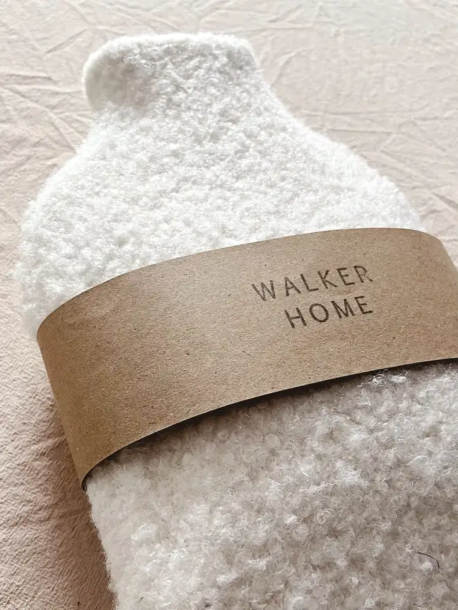 hot water bottle with white wool cover