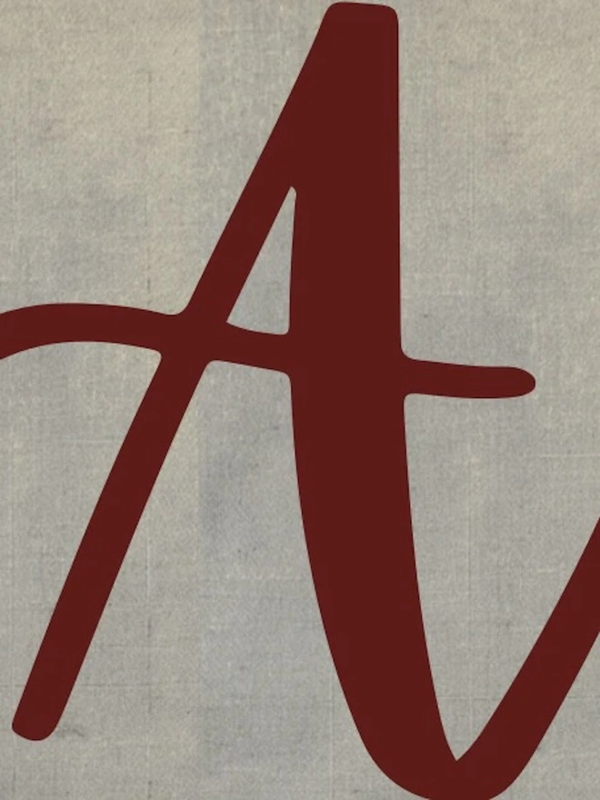 Hand Painted Alphabet Initials Linen Table Napkins, an initial napkin lying on a plain surface. 