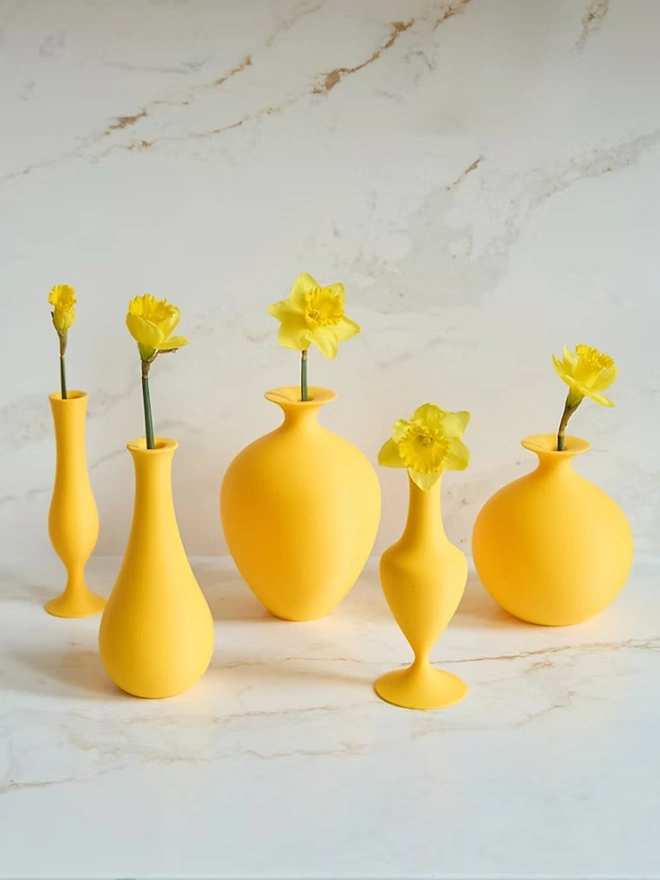 multi shaped yellow 3d printed vase with yellow flower