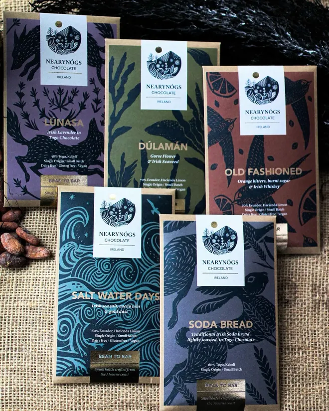 Irish Collection Chocolate Bars (Set Of 5), a collection of chocolate bars sitting on a fabric surface. 