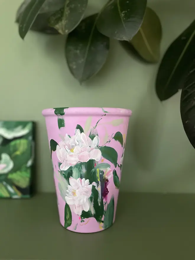 hand painted terracotta floral tall plant pot pale pink background with soft pale pink peony flowers