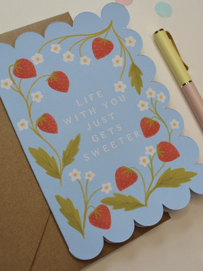 illustrated strawberry anniversary card with scalloped edge