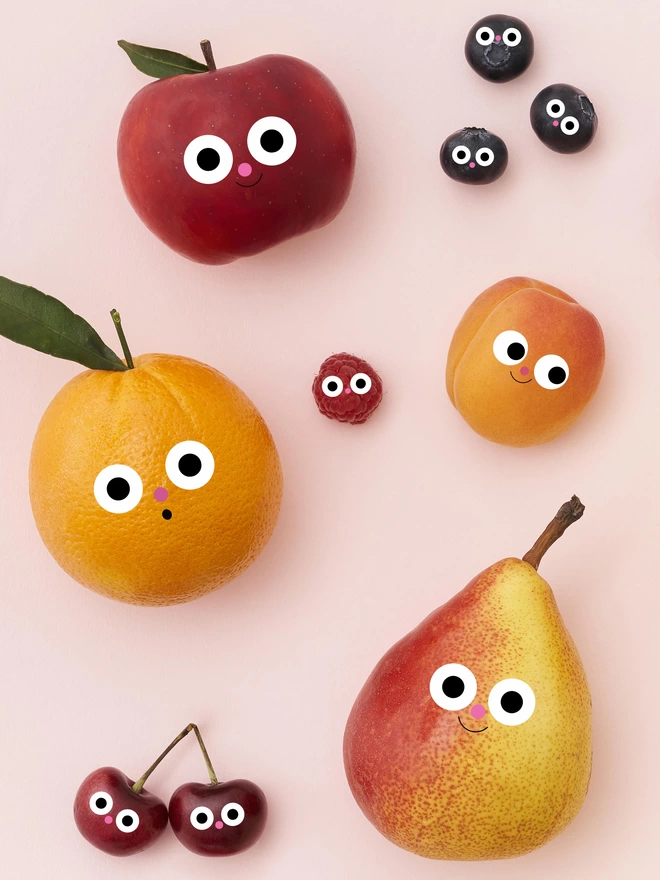 A card detail of the fruits with happy faces