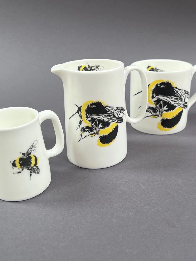 Close up of the bumble bee quarter and half jugs next to the mug showing the different sizes off beautifully