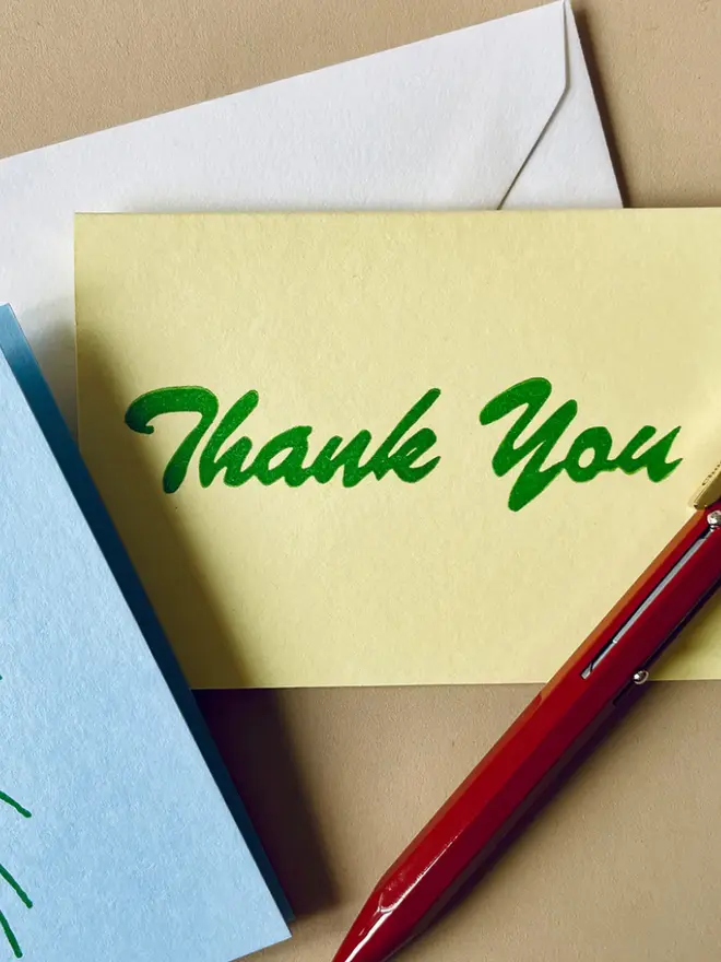 'Thank You' Hand Printed Card in green writing on a yellow background. 