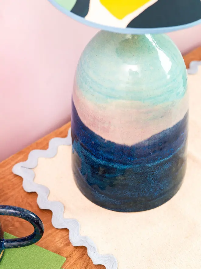 Bottle lamp with shades of blues and pinks
