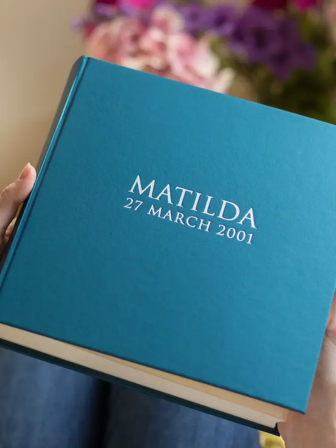 Beautiful Personalised Photo Album for Birthday or New Baby, held by a person. 