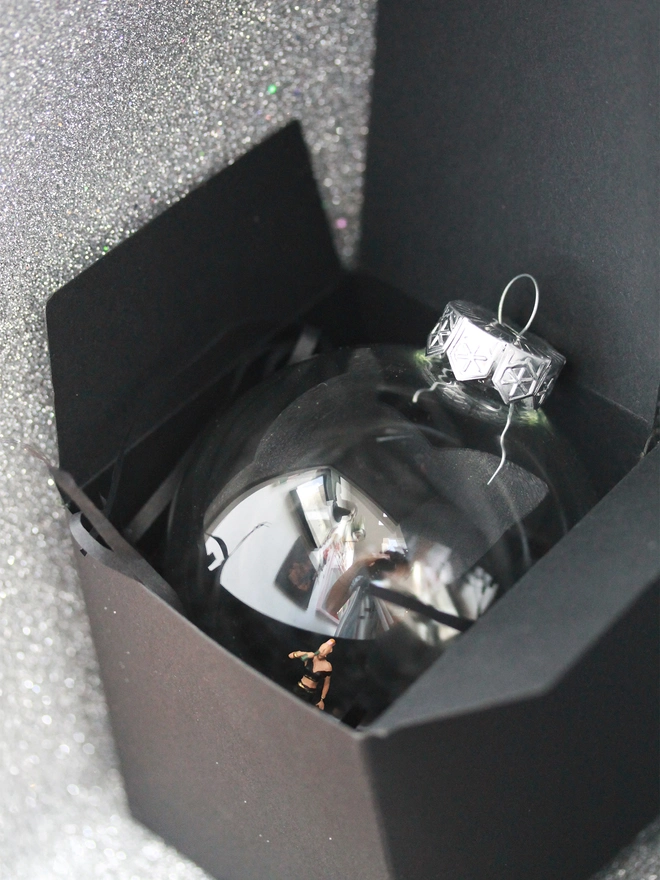 Christmas bauble in open package