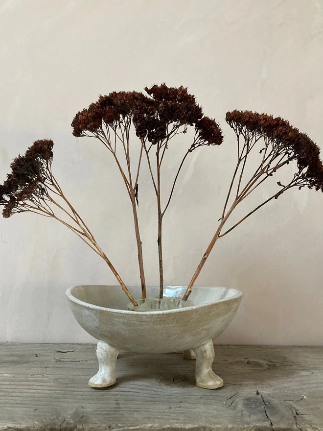 stoneware bowl with dried flowers