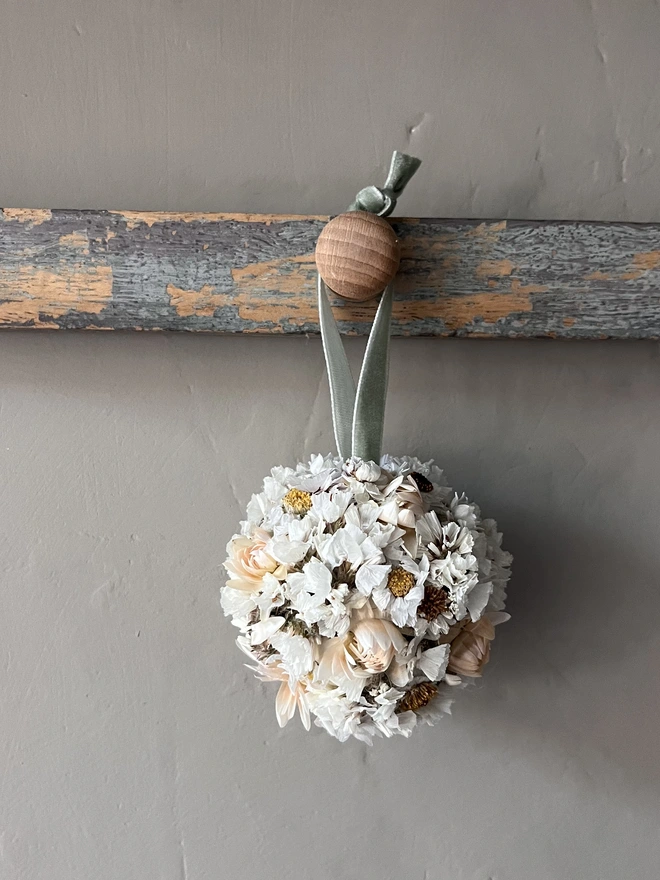 Snow Dried Flower Bauble. A dried flower bauble made of seasonal white flowers.