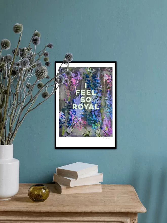 I FEEL SO ROYAL fine art print, based on an original monprint by M.E. Ster-Molnar.  Shown on a teal blue wall with thistle foliage.  
