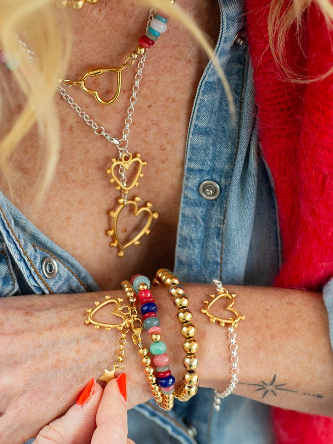 Add a little love to your wrist stack with the Studded Heart Bracelet. Featuring a bold belcher chain and confirmed mini studded heart, plus a personalised extender charm, this modern heart bracelet is made to be worn on repeat — a meaningful piece that celebrates individuality and everyday style.