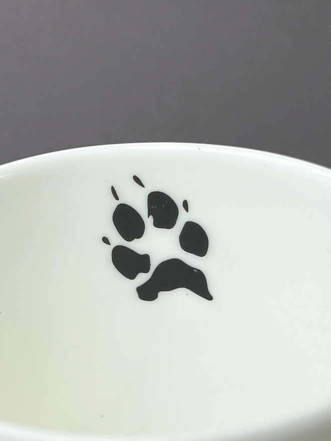 Close up of the collie paw print on the inside of the mug