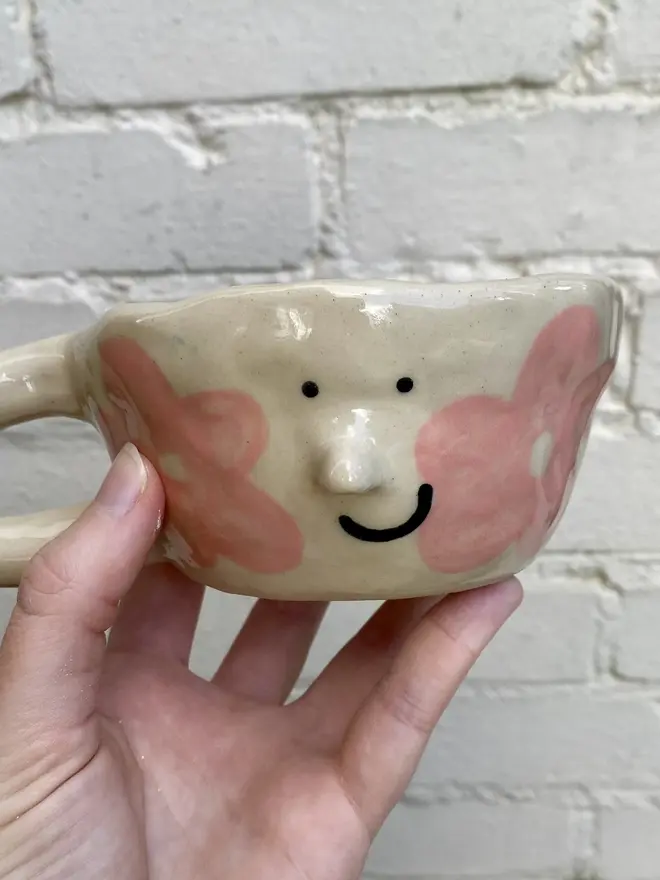 pink flower handmade ceramic smiley face mug