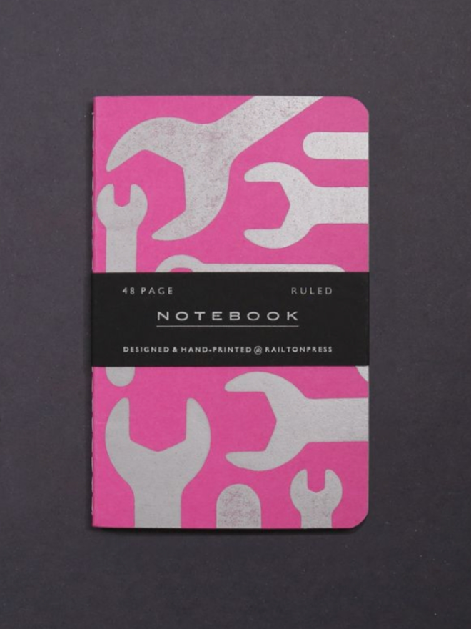 Lined Spanner Pocket Notebook. A notebook in pink