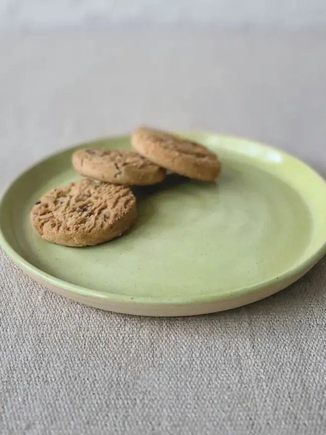 light green ceramic cake plate with textured swirl design