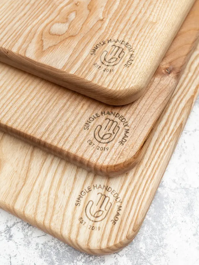 Heart Serving Boards (Set Of 3), on a marble surface. 