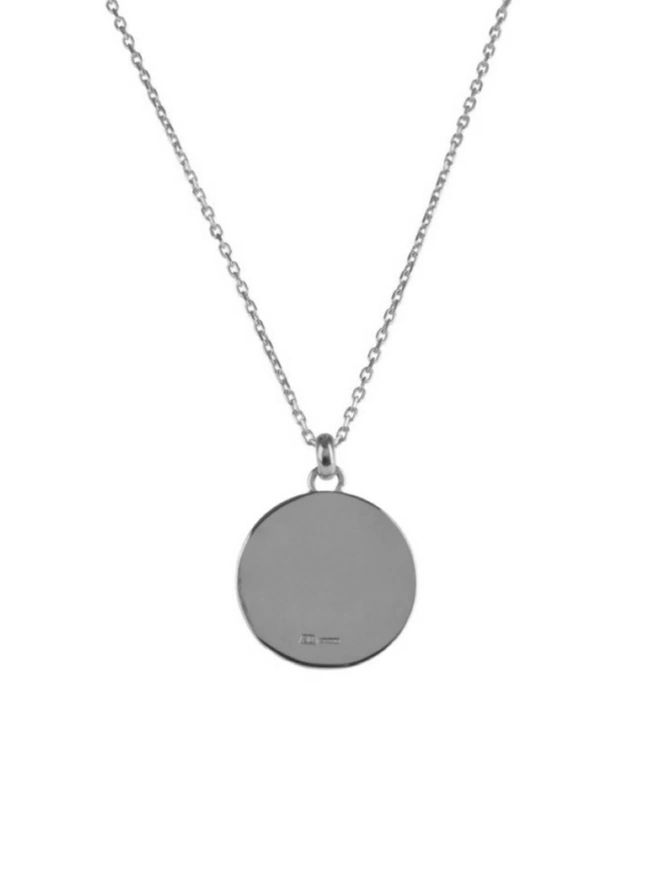smooth highly polished reverse of Atlas pendant by Ruddock