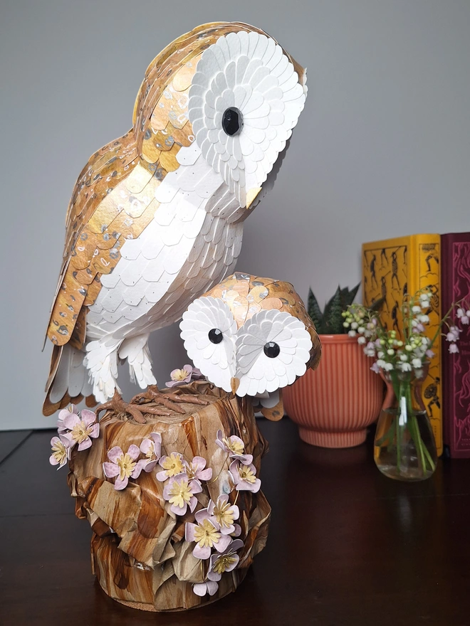 Barn owl mama and baby on a floral tree stump