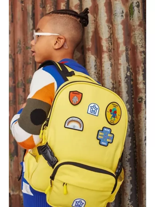 The Maths Whizz Patch seen on a yellow backpack.