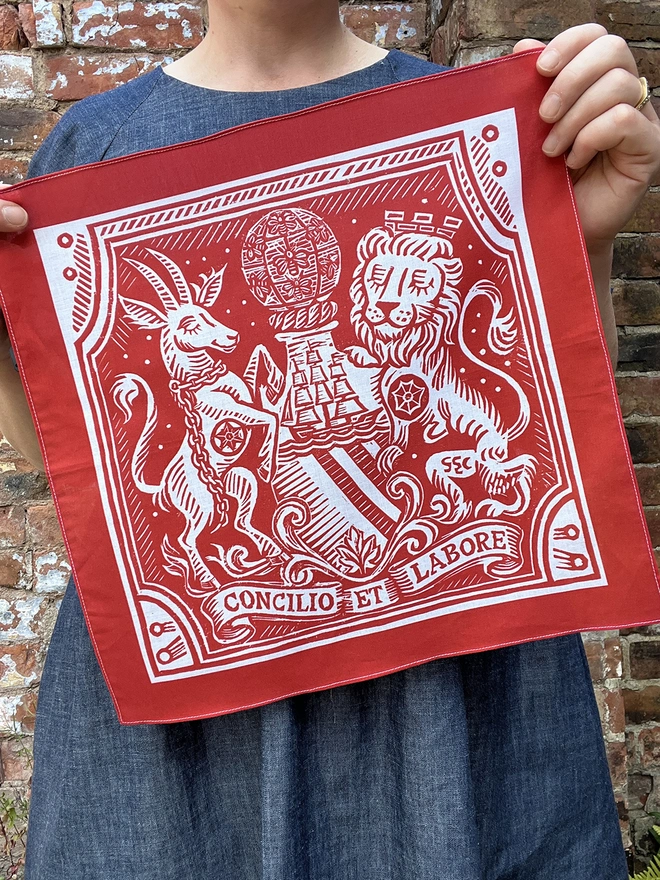 A Mr.PS red Manchester Heraldic Handkerchief with a coat of arms print